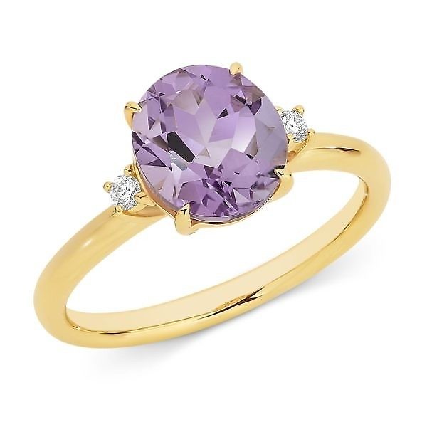 Oval cut amethyst and diamond dress ring