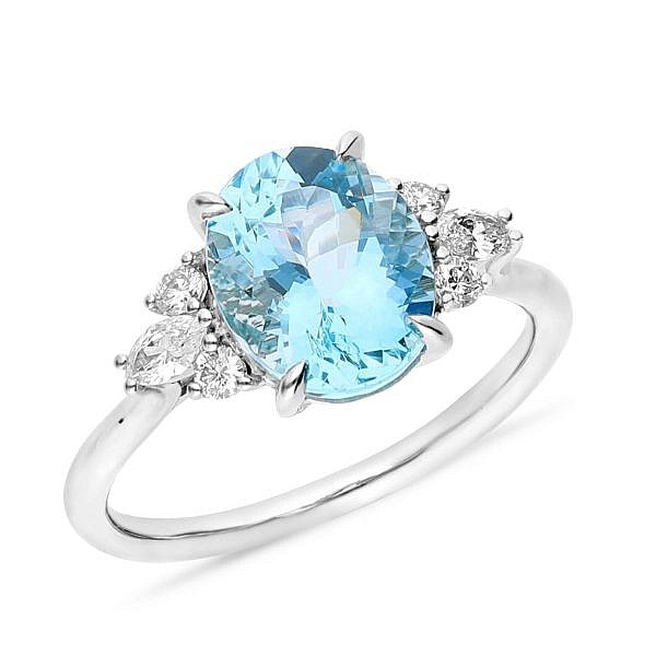 Oval blue topaz & side diamond ring